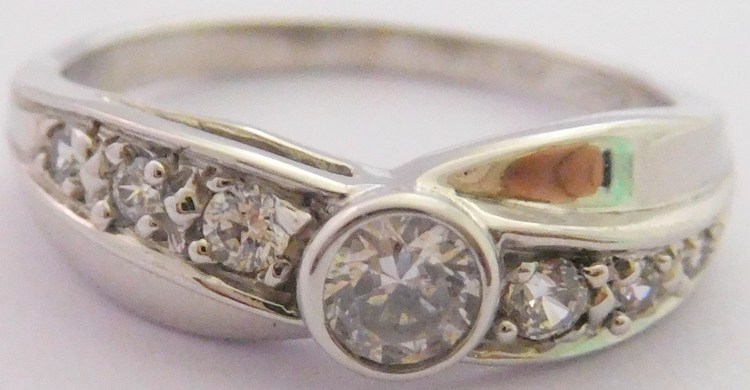 Klenoty Budín Zásnubní prsten z bílého zlata se zirkony 585/2,69gr vel.53 HK1067